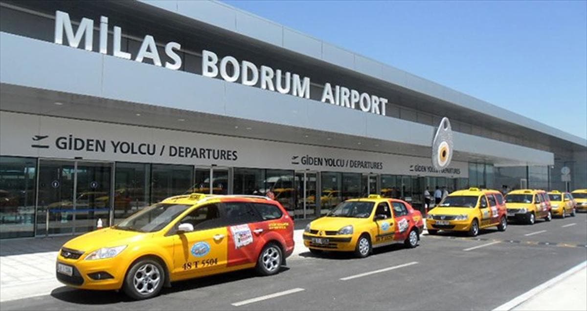Yellow taxis lined up outside the Milas-Bodrum Airport terminal
